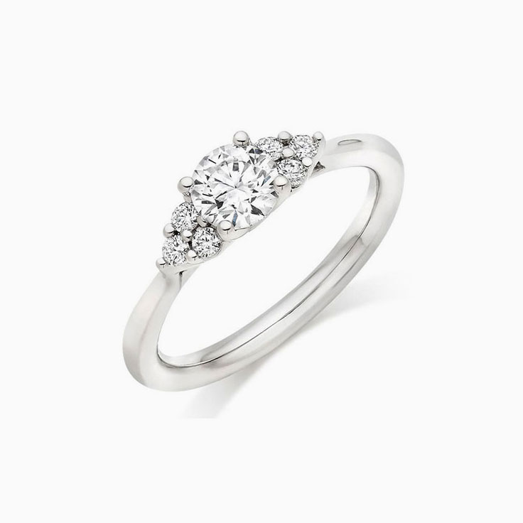 Trilogy setting Round brilliant Diamond Engagement ring