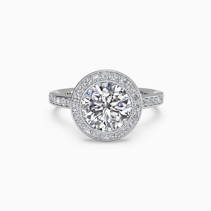 Round Brilliant cut diamond engagement ring with pave halo