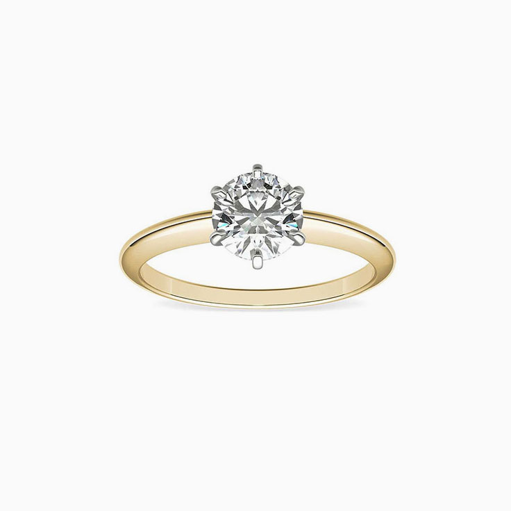 Two tone knife edge engagement ring with round brilliant diamond