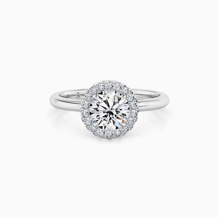Round brilliant cut diamond with a 3d halo engagement ring