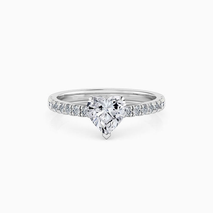 Heart shape diamond engagement ring on a diamond band