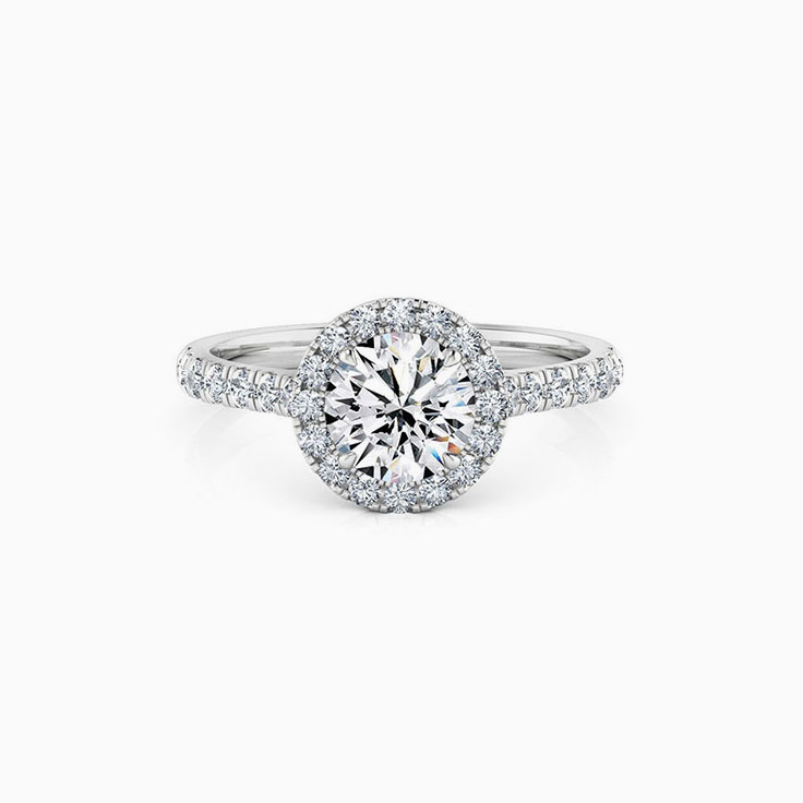 Round halo on cathedral setting engagement ring