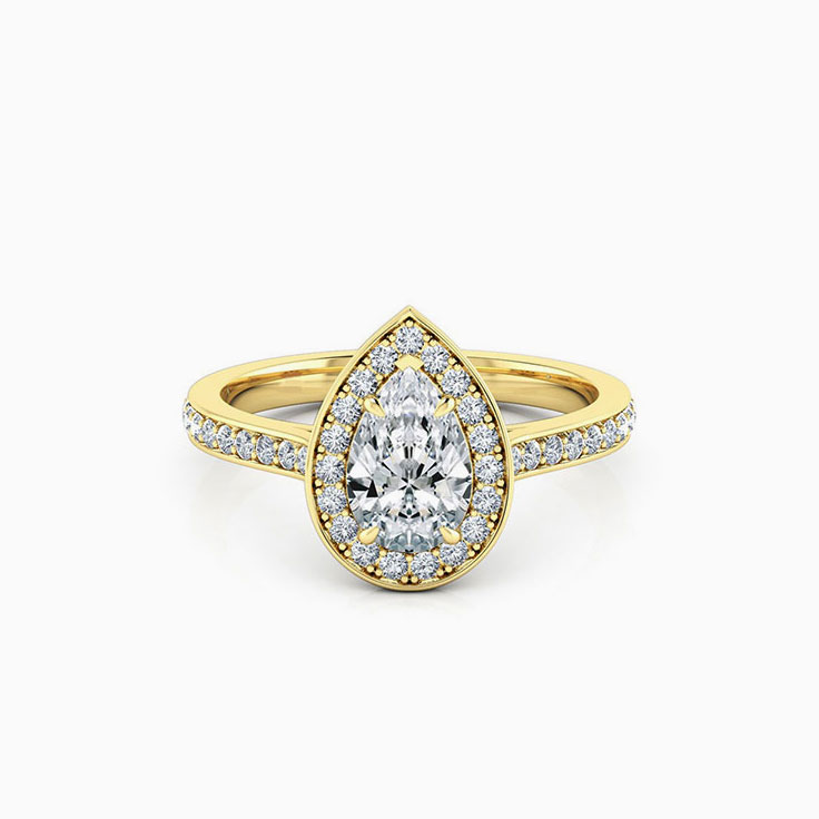 Pear cut diamond engagement ring with pave halo