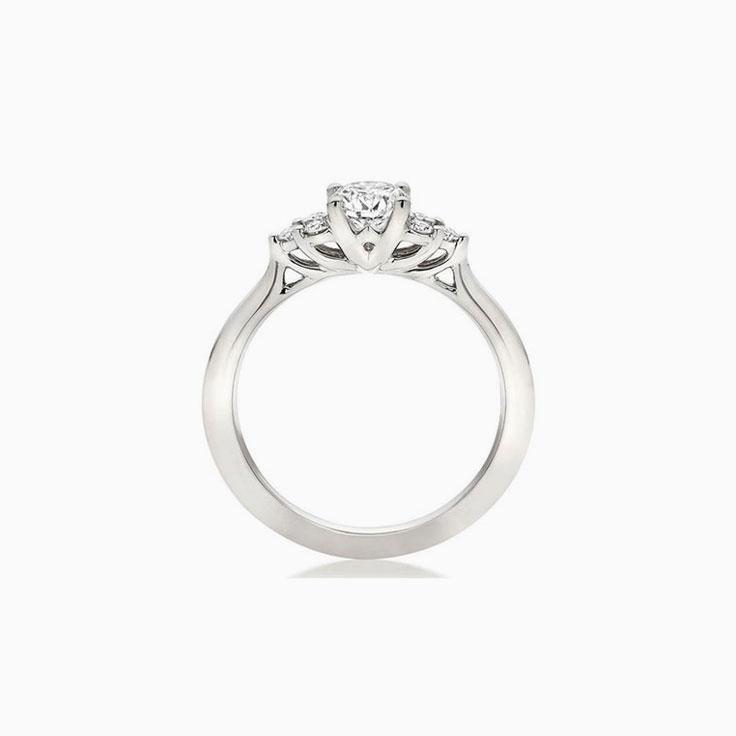 Trilogy setting Round brilliant Diamond Engagement ring