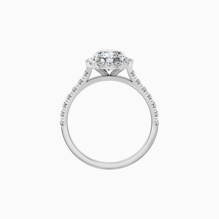 Round halo on cathedral setting engagement ring